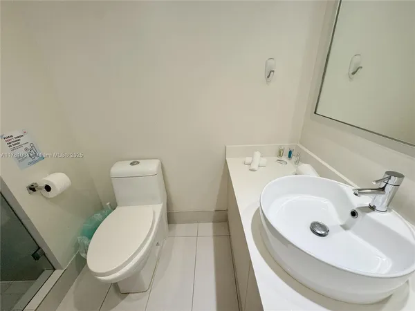 a bathroom with a sink and a toilet