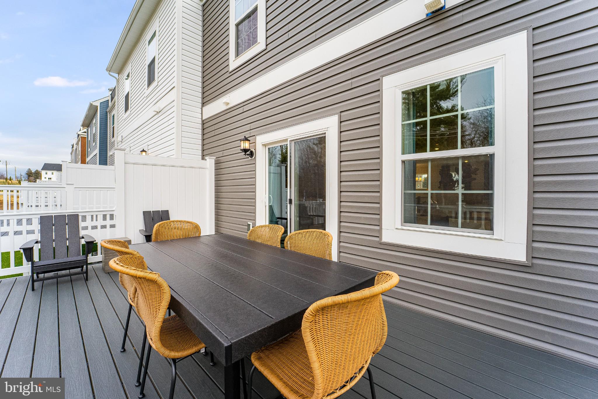 1707 Water Xing Road Baltimore, MD 21208 - Photo 21 of 21 a view of deck with table and chairs and wooden floor