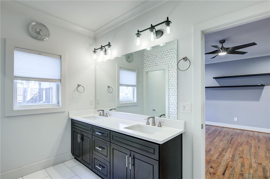 1237 Milton Terrace Southeast Atlanta, GA 30315 - Photo 15 of 28 a bathroom with a sink double vanity and a mirror