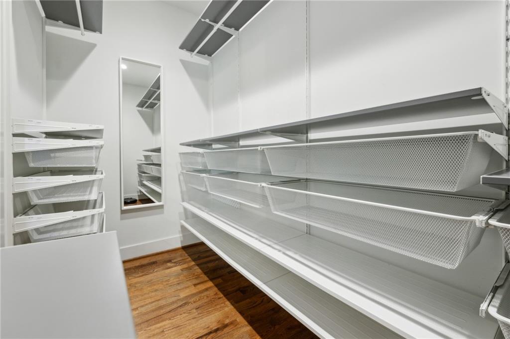 1237 Milton Terrace Southeast Atlanta, GA 30315 - Photo 18 of 28 a view of walk in closet with empty racks