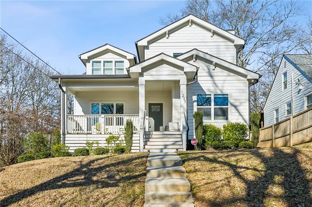 1237 Milton Terrace Southeast Atlanta, GA 30315 - Photo 2 of 28 a view of a house with a small yard plants and large tree