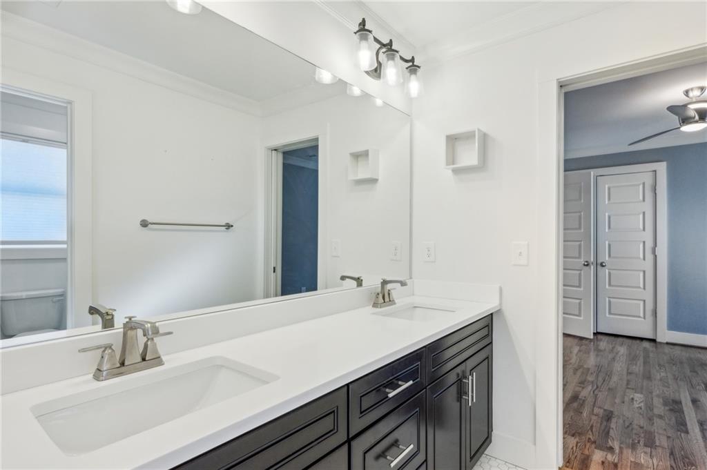 1237 Milton Terrace Southeast Atlanta, GA 30315 - Photo 22 of 28 a bathroom with a sink double vanity and a mirror