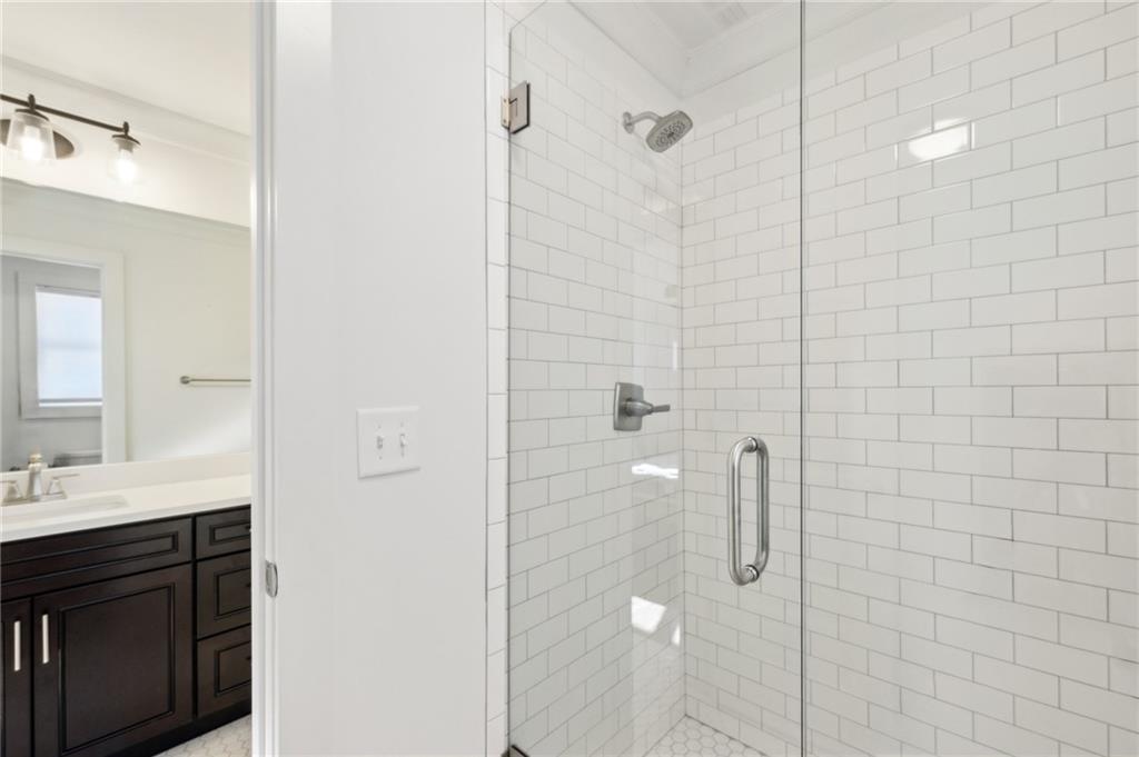 1237 Milton Terrace Southeast Atlanta, GA 30315 - Photo 23 of 28 a bathroom with a shower and a sink