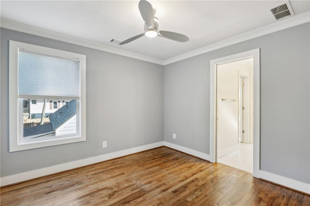 1237 Milton Terrace Southeast Atlanta, GA 30315 - Photo 24 of 28 a view of empty room with wooden floor and fan