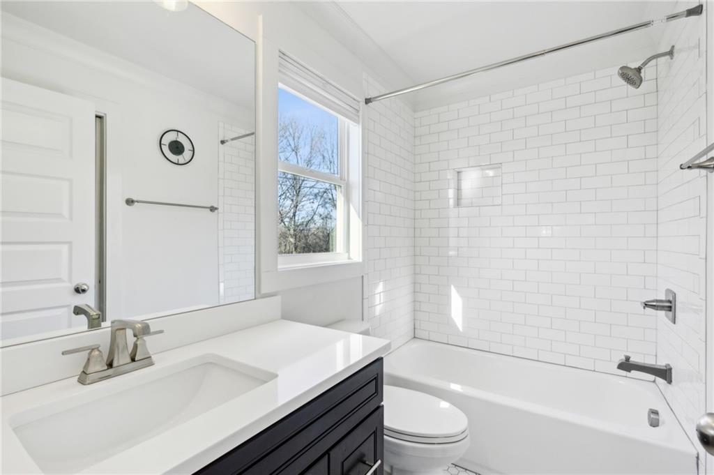 1237 Milton Terrace Southeast Atlanta, GA 30315 - Photo 26 of 28 a bathroom with a sink a toilet and shower