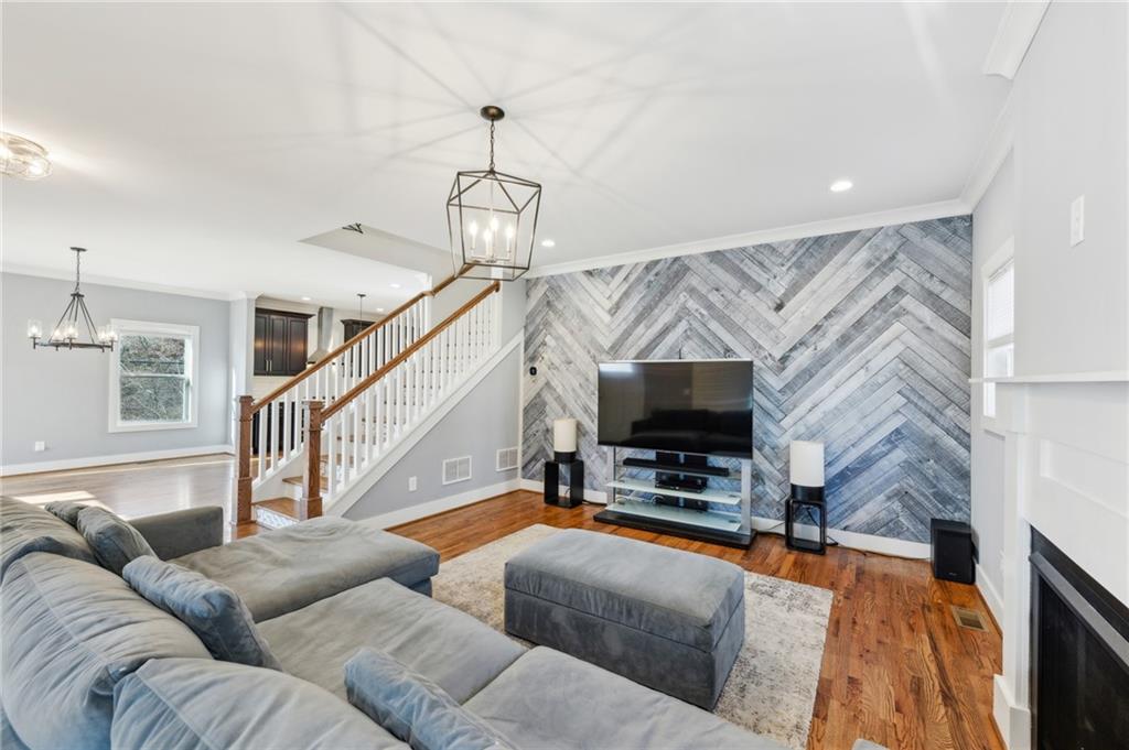 1237 Milton Terrace Southeast Atlanta, GA 30315 - Photo 6 of 28 a living room with furniture and a flat screen tv