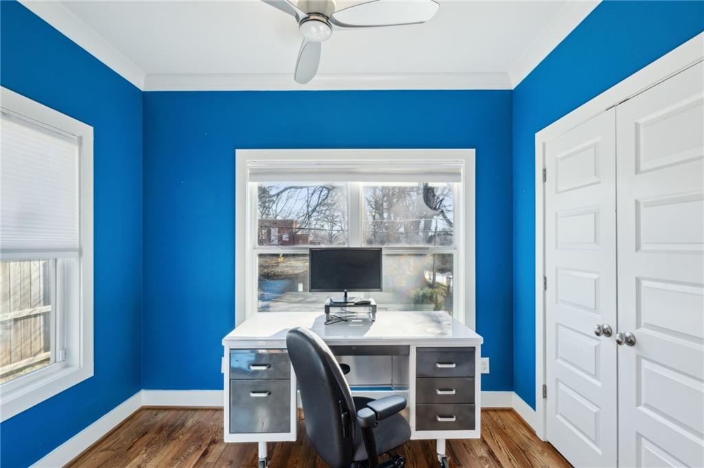 1237 Milton Terrace Southeast Atlanta, GA 30315 - Photo 7 of 28 a view of a workspace with furniture and wooden floor