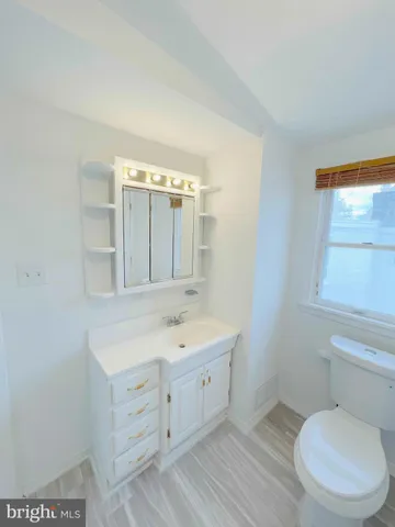 a bathroom with a bathtub and toilet