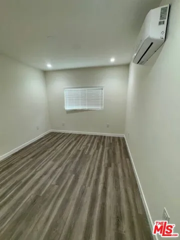 a bathroom with a sink mirror vanity and toilet