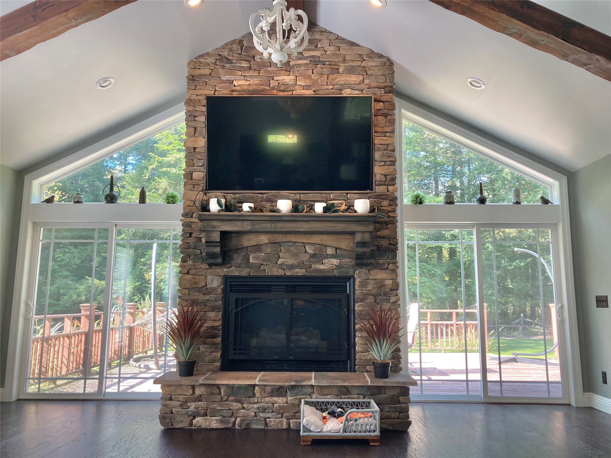 485 Spencer Road Corry, PA 16407 - Photo 7 of 46 This soaring fireplace anchors the room and is flanked by sliding doors giving you access to the large deck and backyard