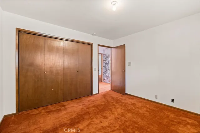 a view of a house with a snow in the yard