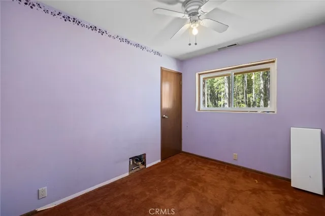 an aerial view of a house with a yard basket ball court and outdoor seating