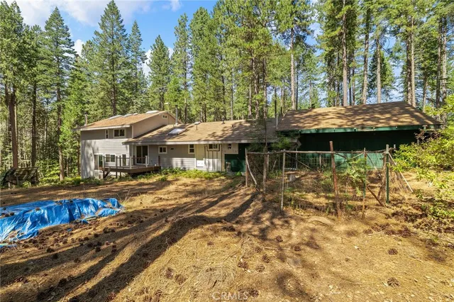 a view of an entryway with wooden floor and a kitchen
