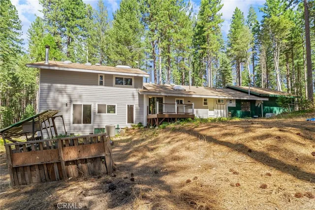 a kitchen with a sink a window and cabinets