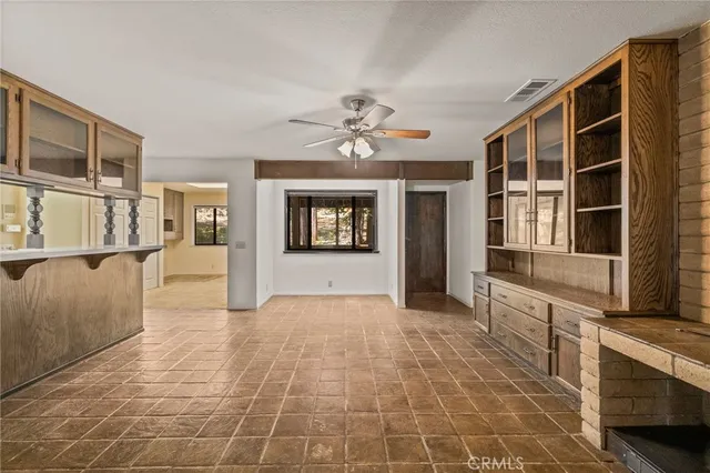 a view of a barn in the middle of a yard