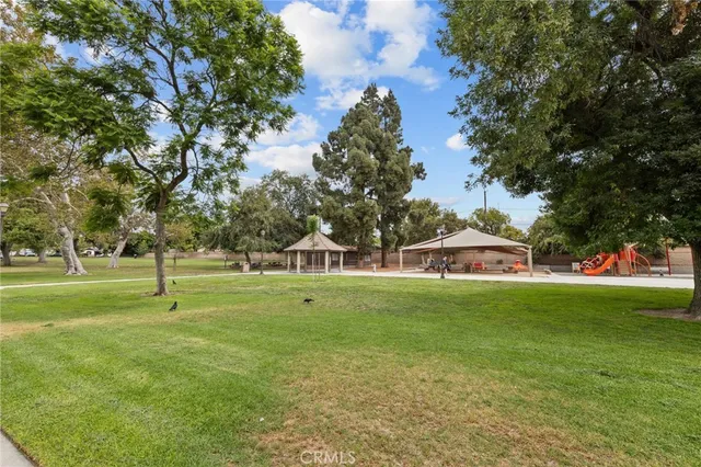 a house with lots of trees in the background