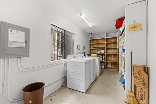 a kitchen with a refrigerator and a stove