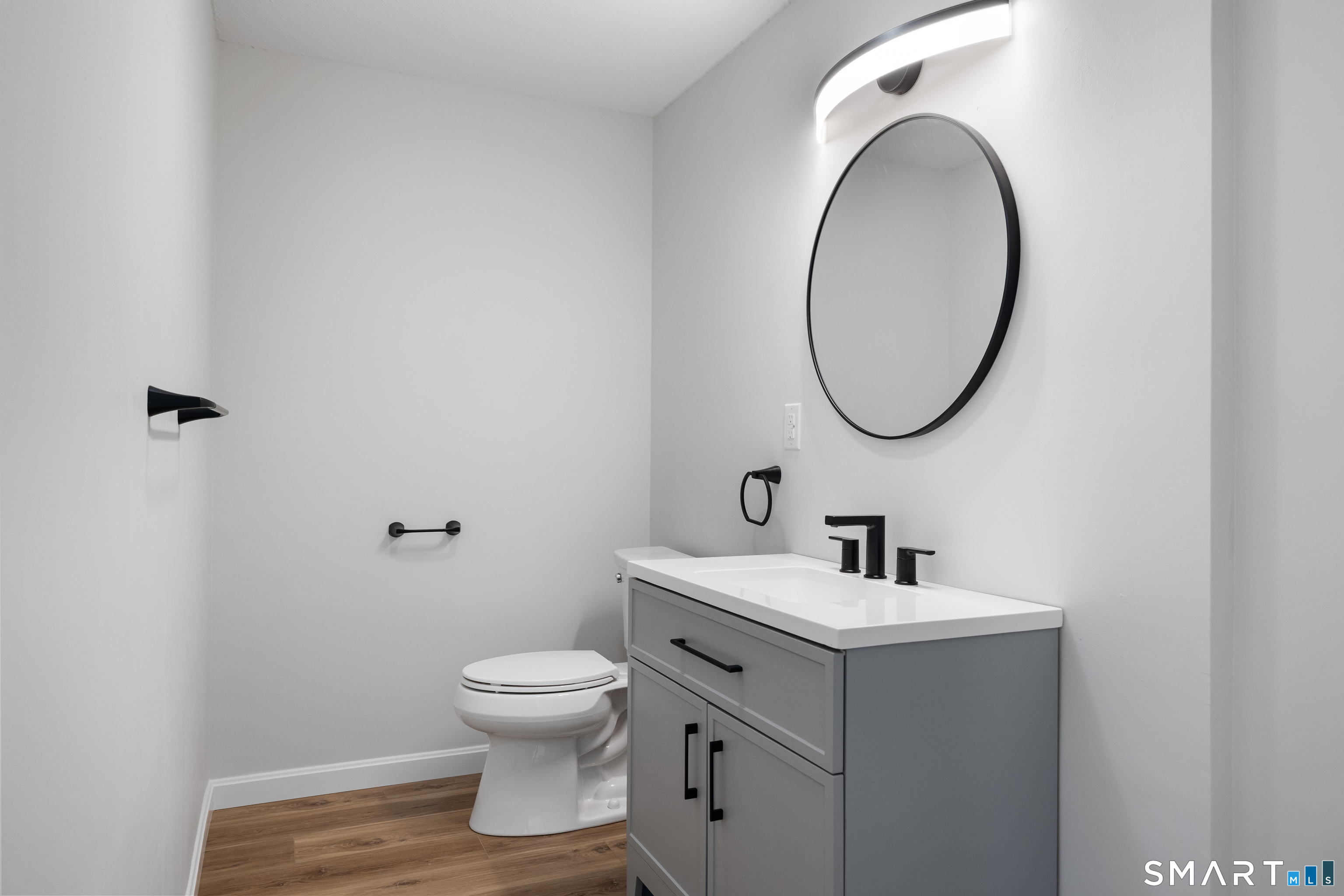 464 Dowd Avenue, Unit 464 Canton, CT 06019 - Photo 17 of 31 Remodeled half bath with laundry on the main level