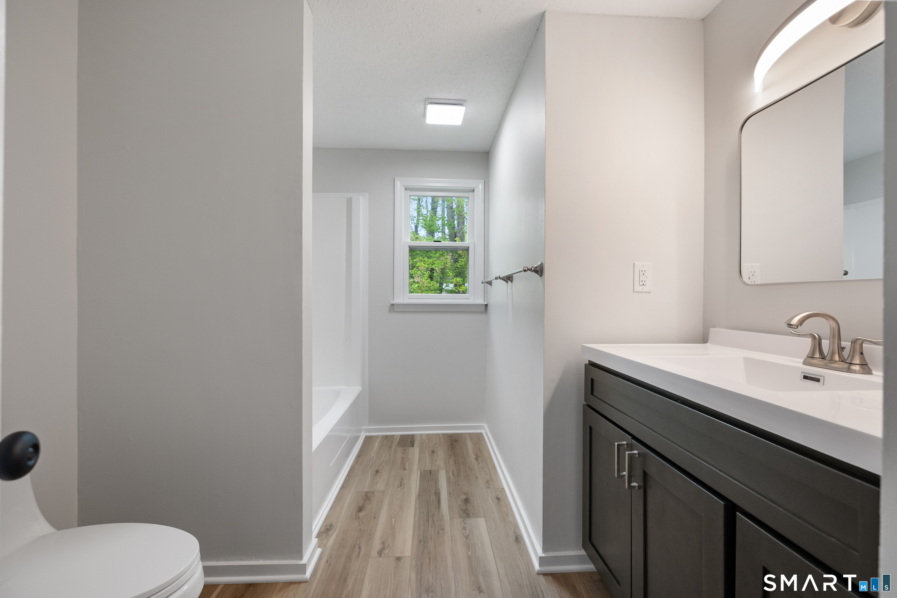 464 Dowd Avenue, Unit 464 Canton, CT 06019 - Photo 24 of 31 Remodeled full bath located on the upper level