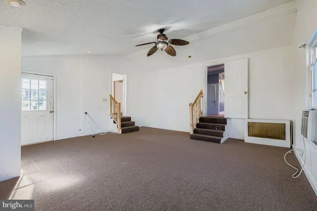 a view of empty room with windows
