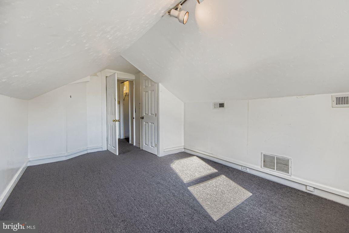 5710 Highgate Drive Baltimore, MD 21215 - Photo 18 of 28 a view of a room with an empty space