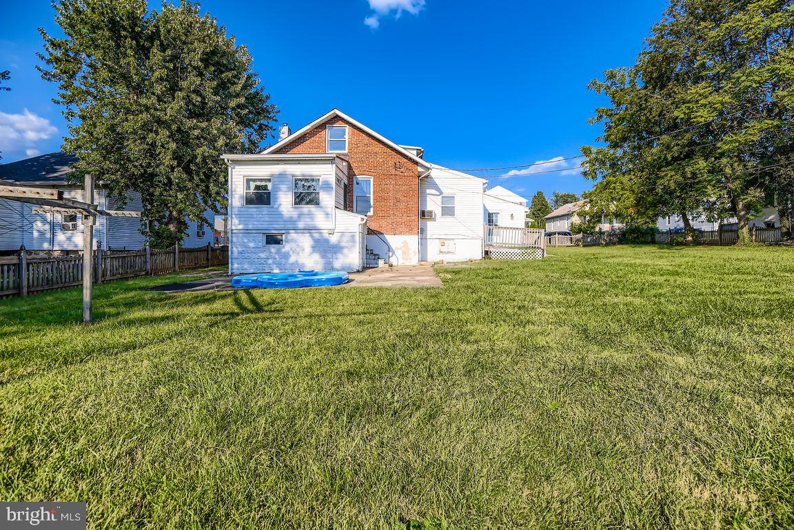 5710 Highgate Drive Baltimore, MD 21215 - Photo 28 of 28 a front view of a house with a yard