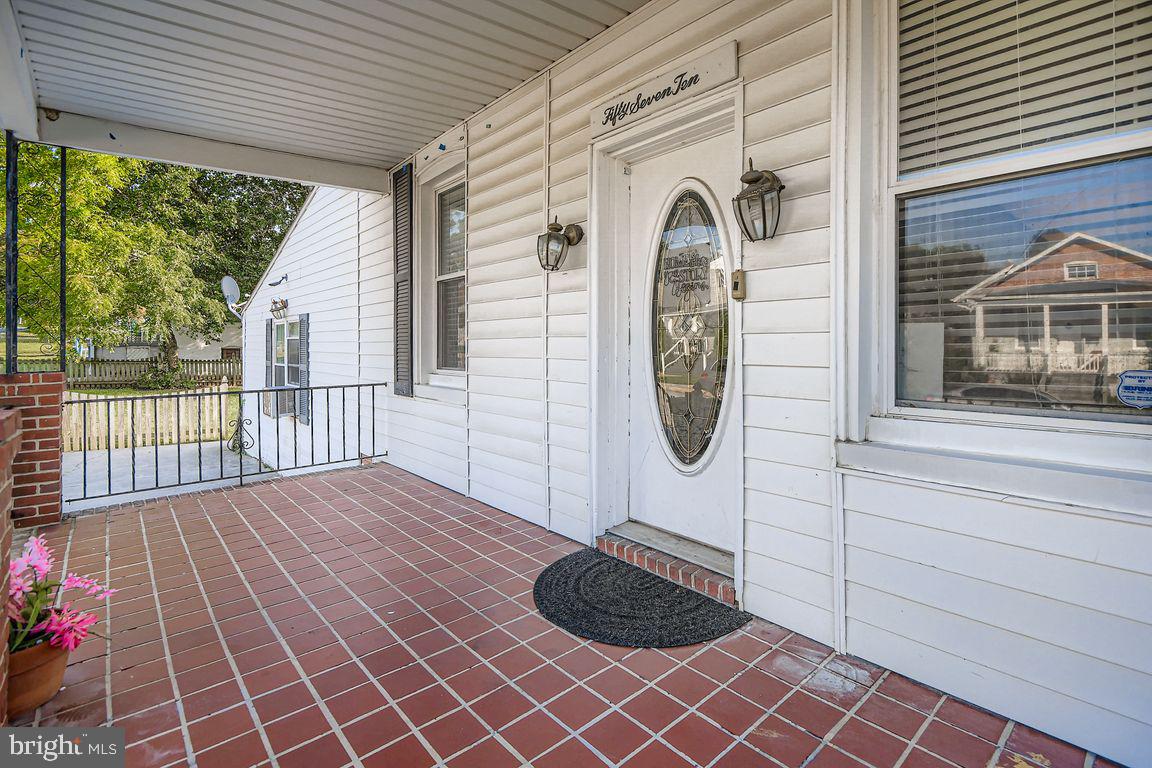 5710 Highgate Drive Baltimore, MD 21215 - Photo 4 of 28 a front view of a house with a garden