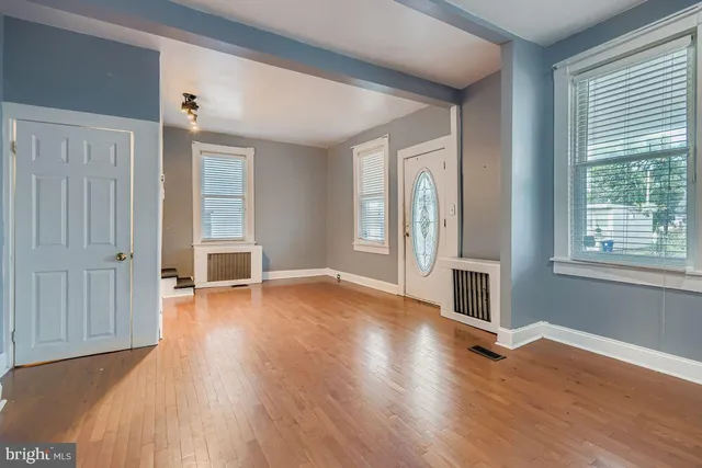 a view of a livingroom with wooden floor