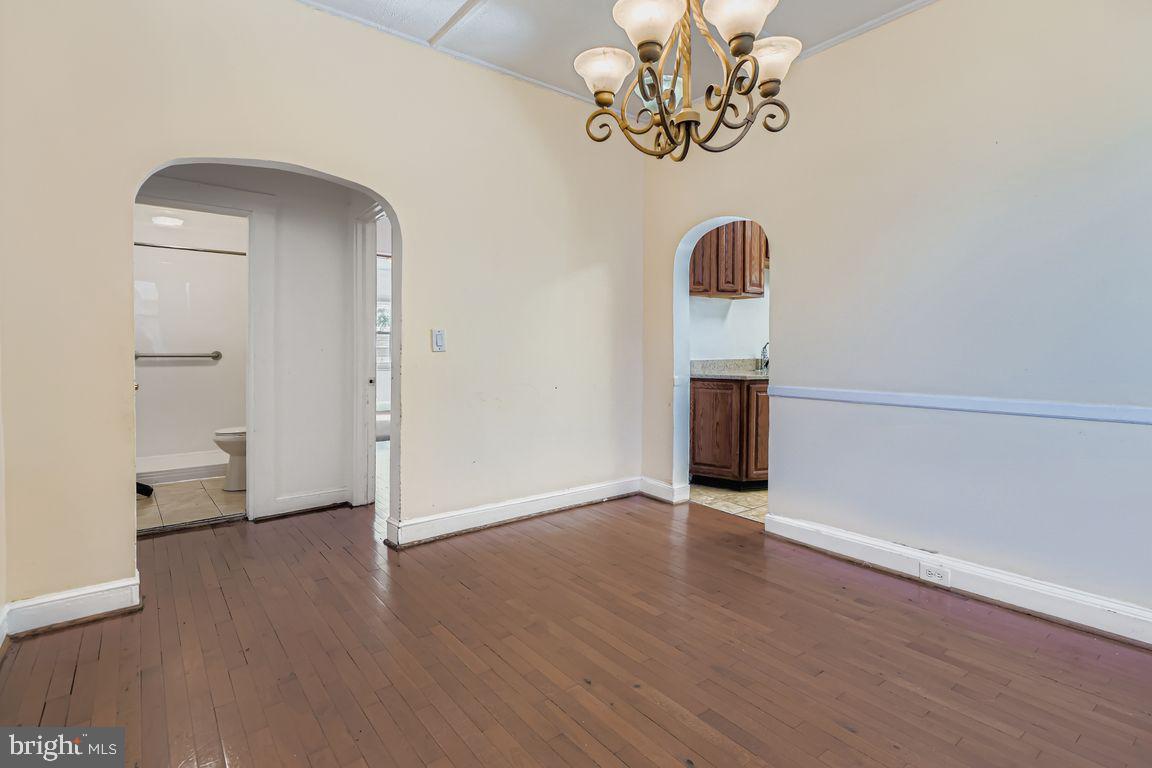 5710 Highgate Drive Baltimore, MD 21215 - Photo 8 of 28 a view of a room with wooden floor and window