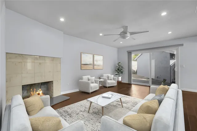 a living room with furniture and a fireplace
