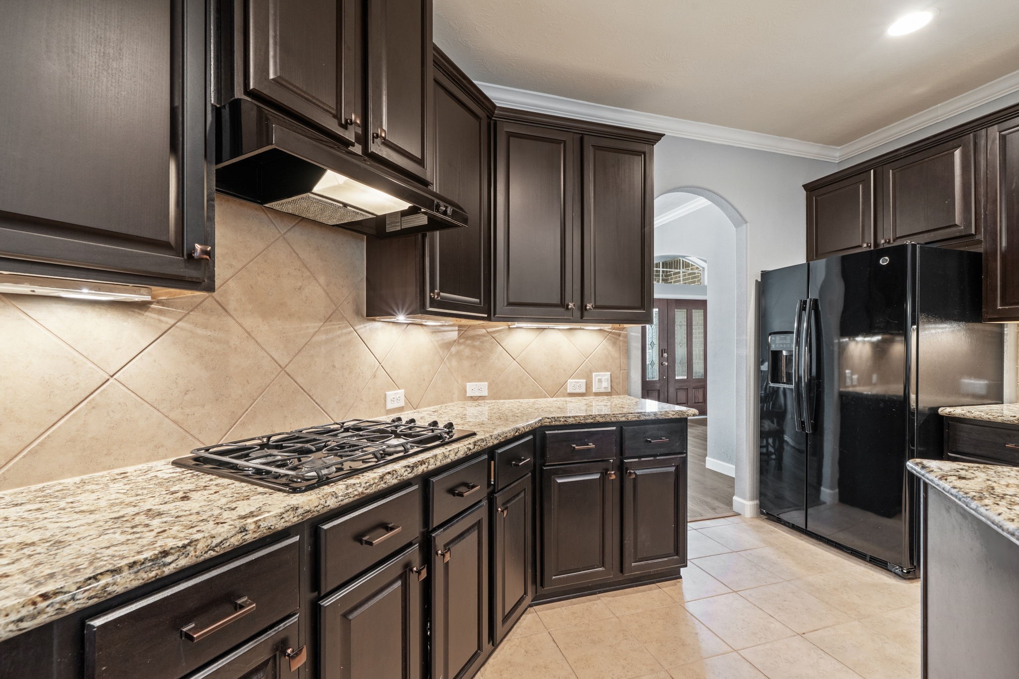 30707 Dodson Trace Drive Spring, TX 77386 - Photo 11 of 43 a kitchen with stainless steel appliances granite countertop a stove and a refrigerator