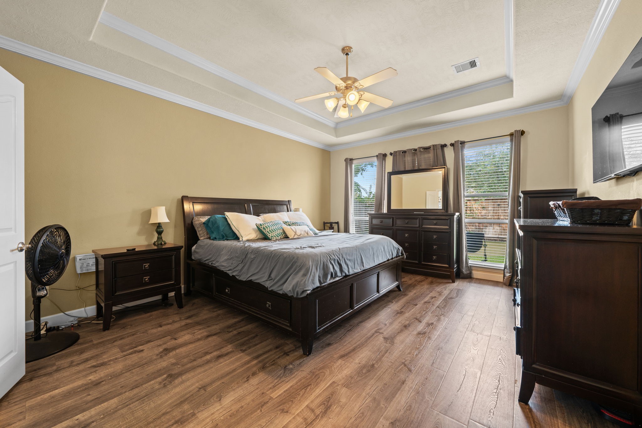 30707 Dodson Trace Drive Spring, TX 77386 - Photo 19 of 43 a bedroom with a bed and wooden floor