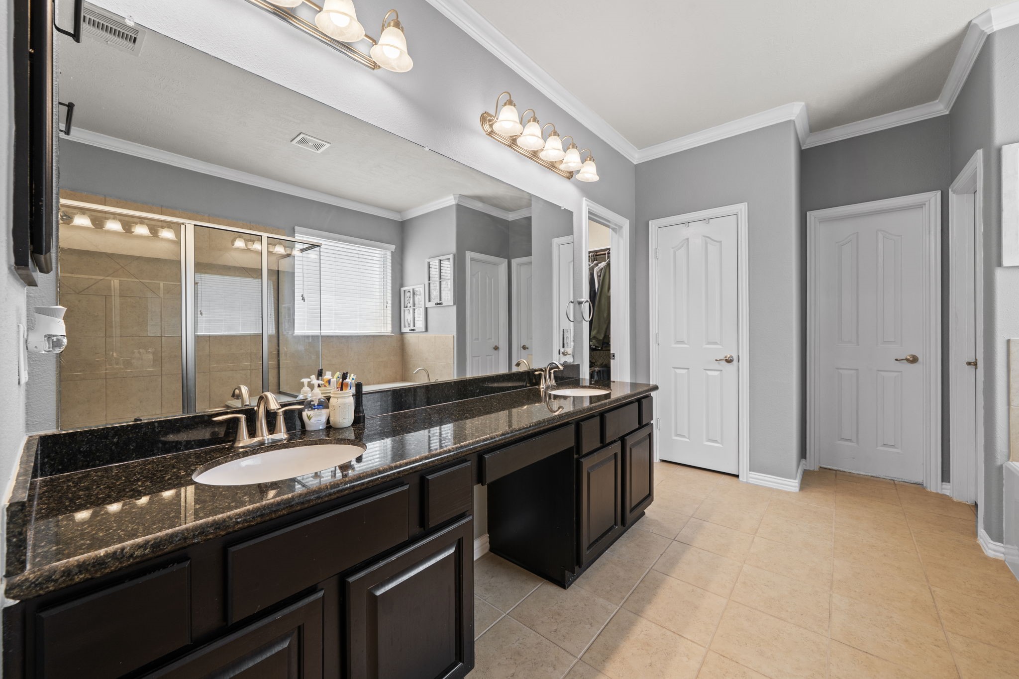 30707 Dodson Trace Drive Spring, TX 77386 - Photo 20 of 43 a kitchen with a sink and large windows