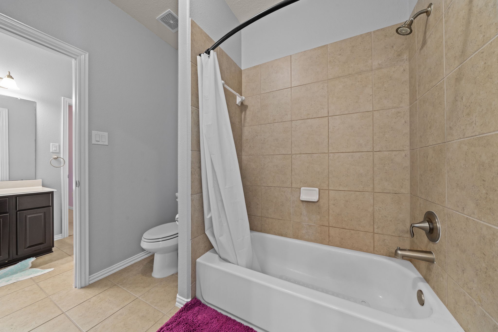 30707 Dodson Trace Drive Spring, TX 77386 - Photo 27 of 43 a bath room with a toilet and a bath tub