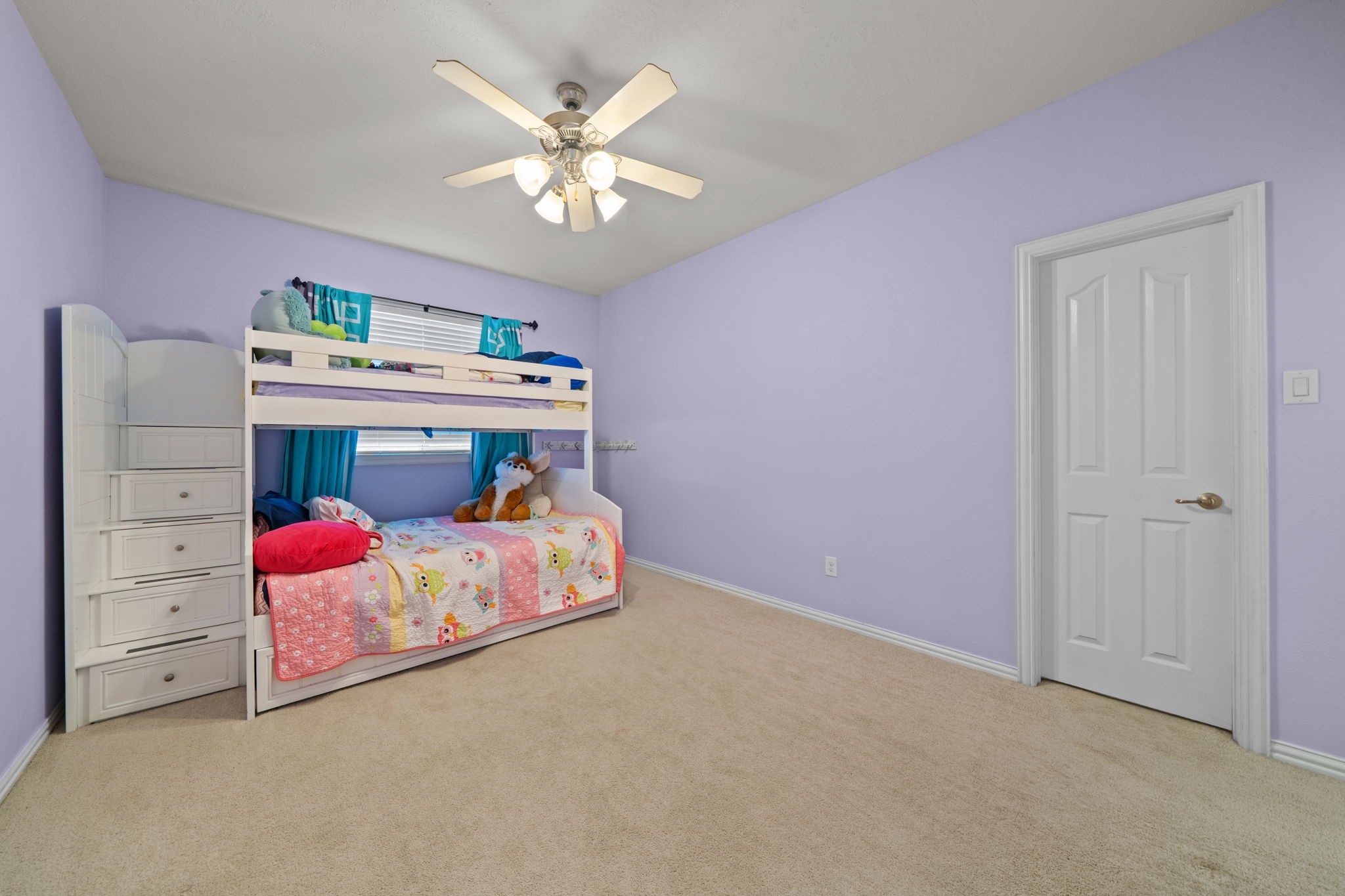 30707 Dodson Trace Drive Spring, TX 77386 - Photo 30 of 43 a bedroom with a bed and a chandelier