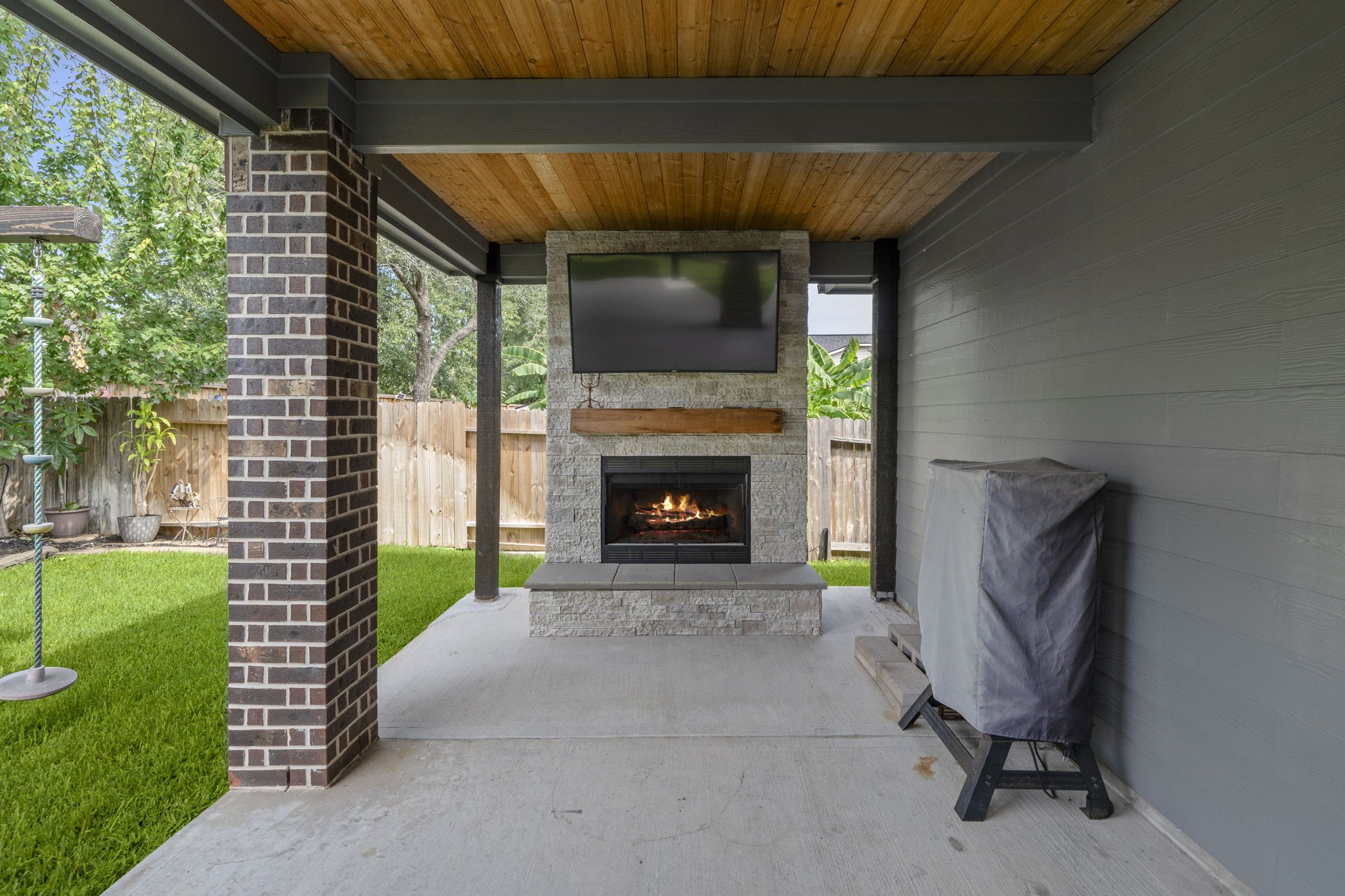 30707 Dodson Trace Drive Spring, TX 77386 - Photo 35 of 43 a living room with a fireplace and a garden
