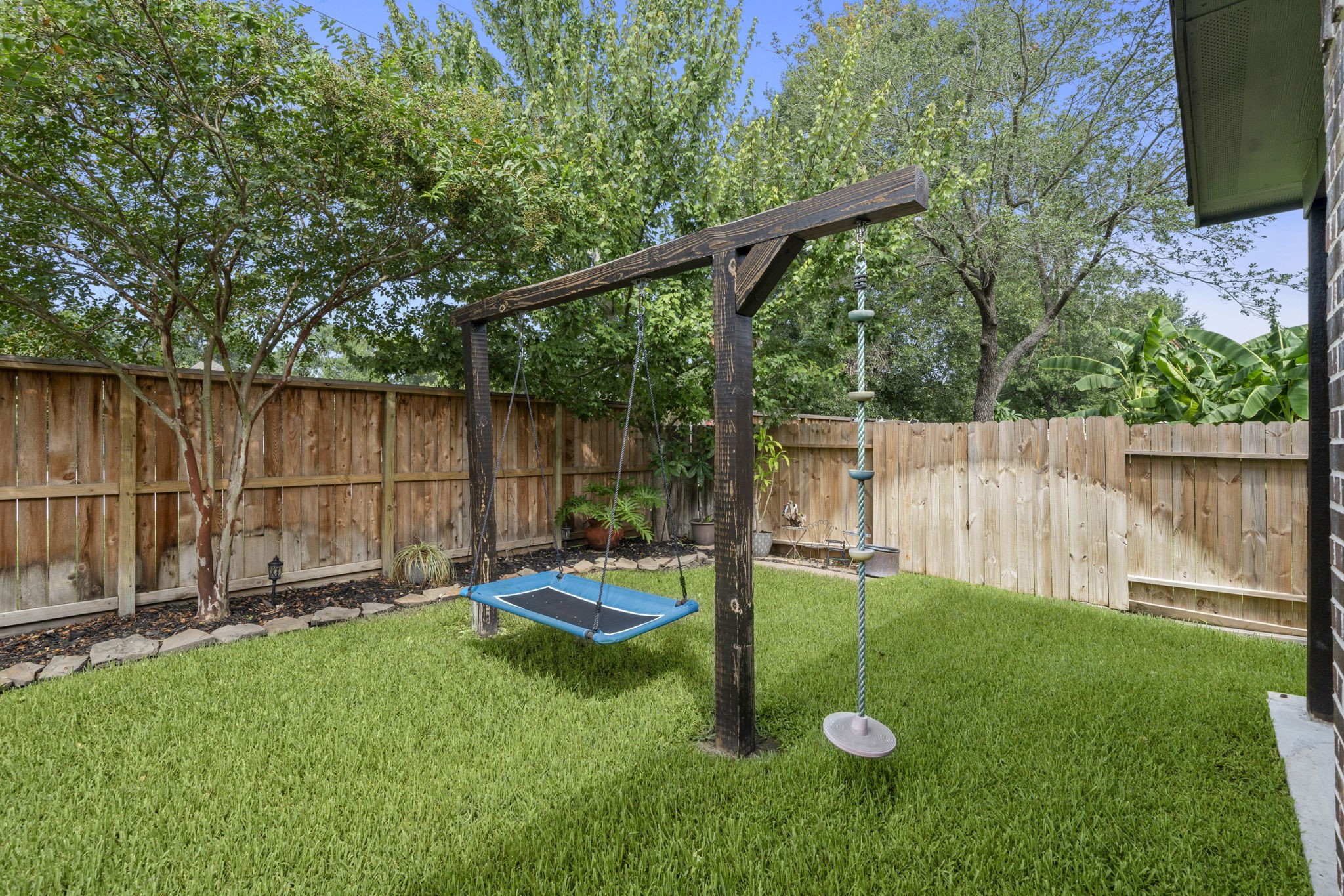 30707 Dodson Trace Drive Spring, TX 77386 - Photo 36 of 43 a backyard of a house with yard and wooden fence