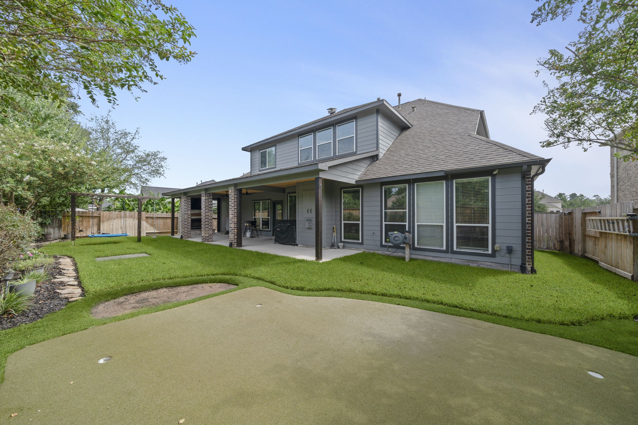 30707 Dodson Trace Drive Spring, TX 77386 - Photo 39 of 43 front view of a brick house with a yard