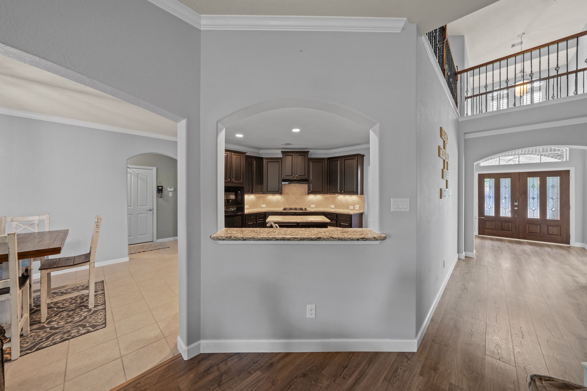 30707 Dodson Trace Drive Spring, TX 77386 - Photo 8 of 43 a view of kitchen with kitchen island wooden floor and refrigerator