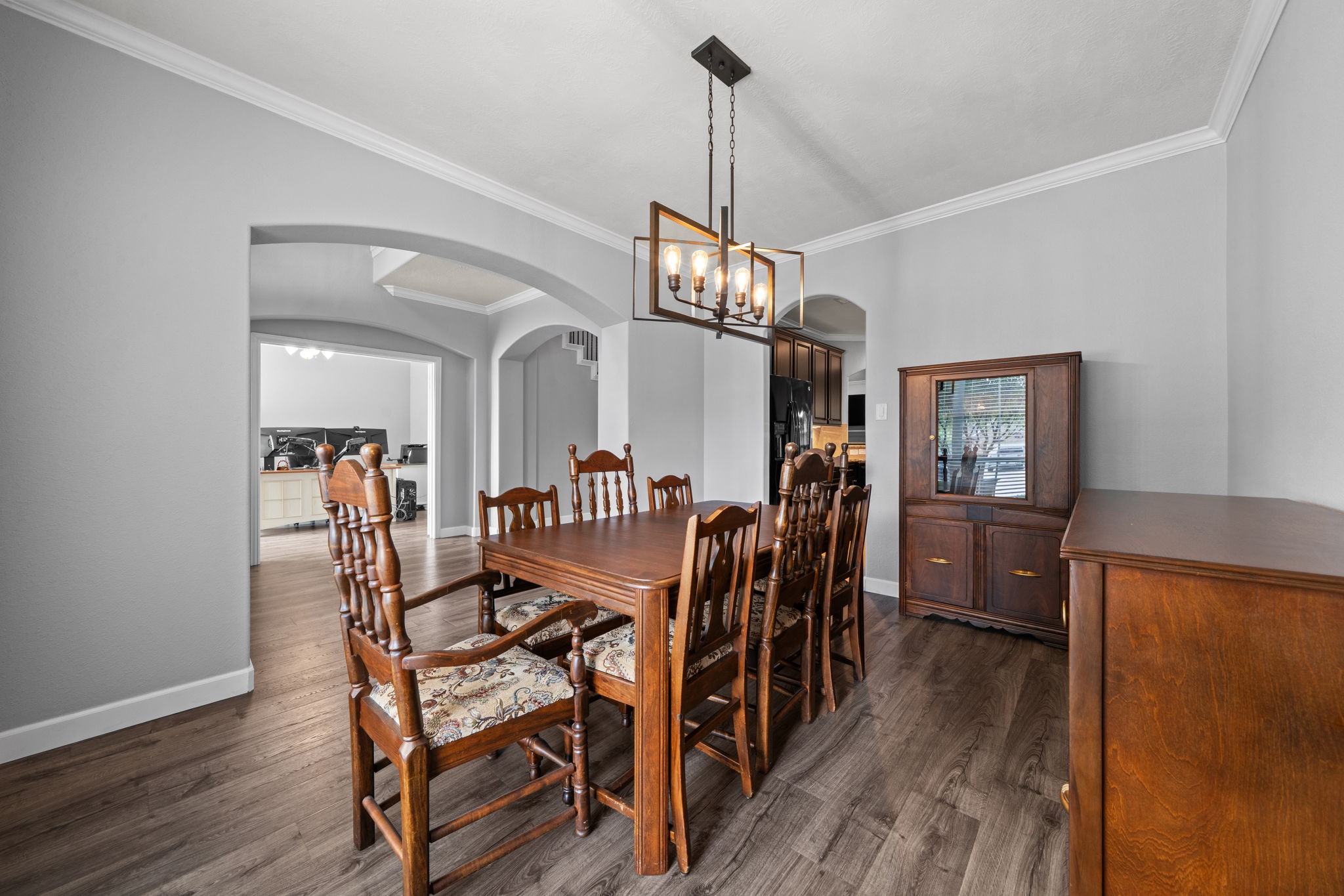30707 Dodson Trace Drive Spring, TX 77386 - Photo 9 of 43 a view of a dining room with furniture wooden floor and a chandelier