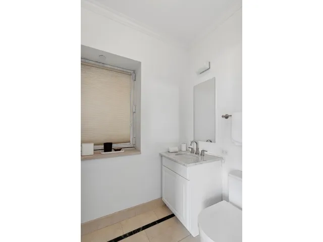 a en suite bathroom with a sink and a mirror