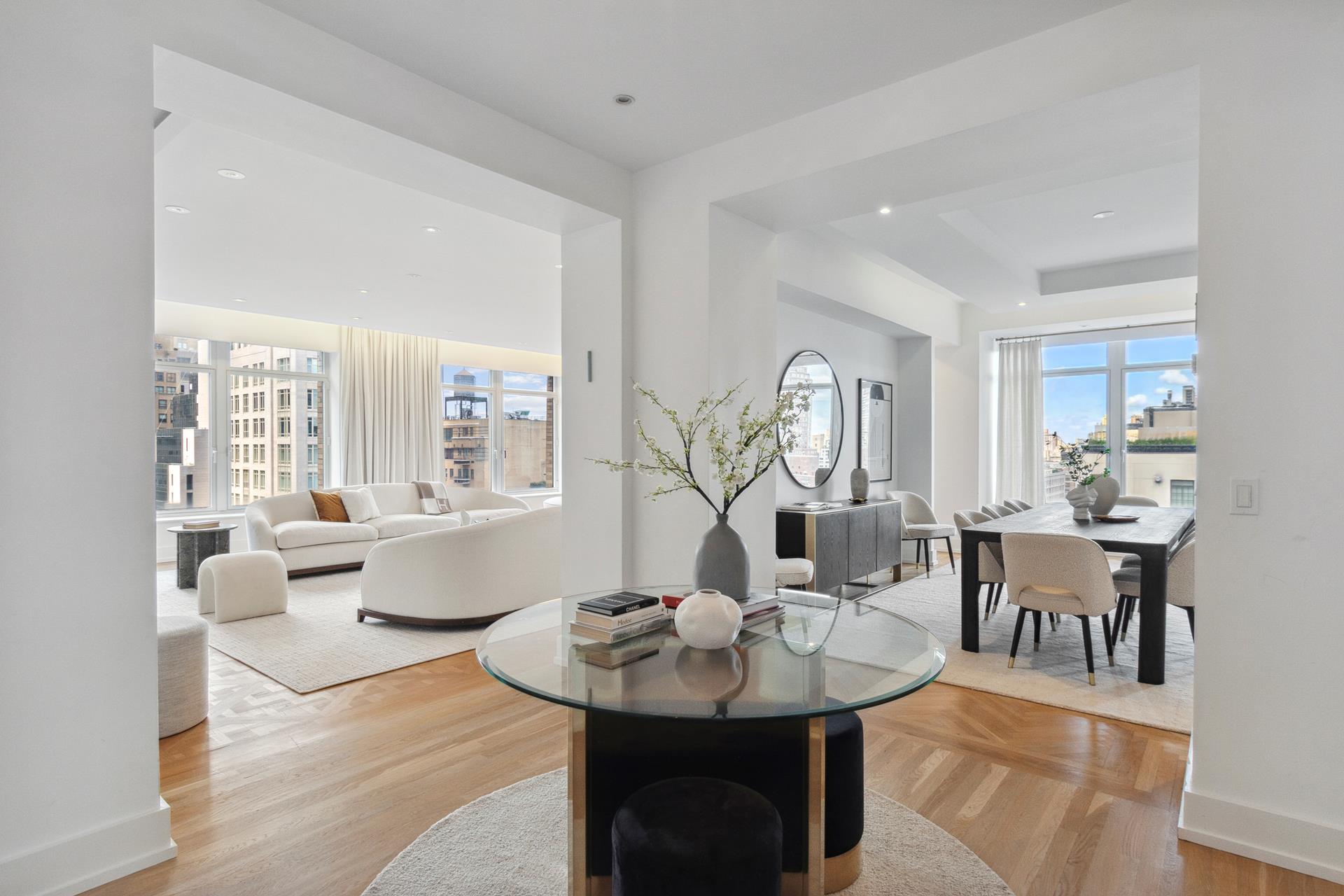 515 Park Avenue, Unit 19 Manhattan, NY 10022 - Photo 5 of 19 a living room with furniture and wooden floor