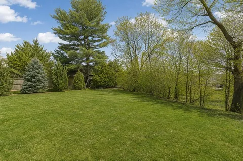 a view of outdoor space with deck and yard