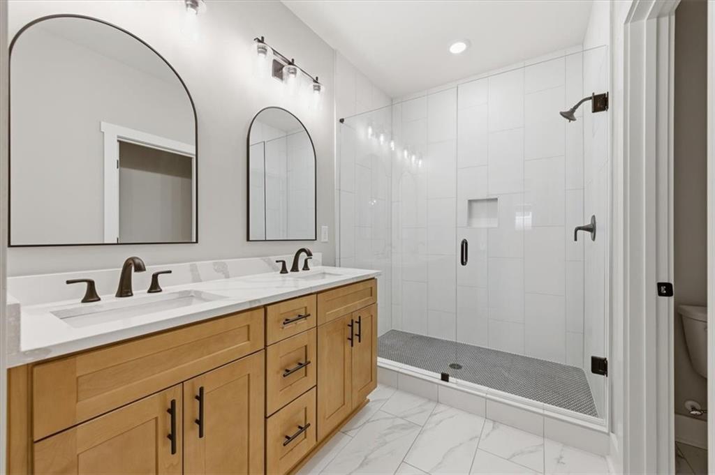 141 Old Alabama Road Southeast Emerson, GA 30137 - Photo 12 of 47 a bathroom with a double vanity sink mirror and double