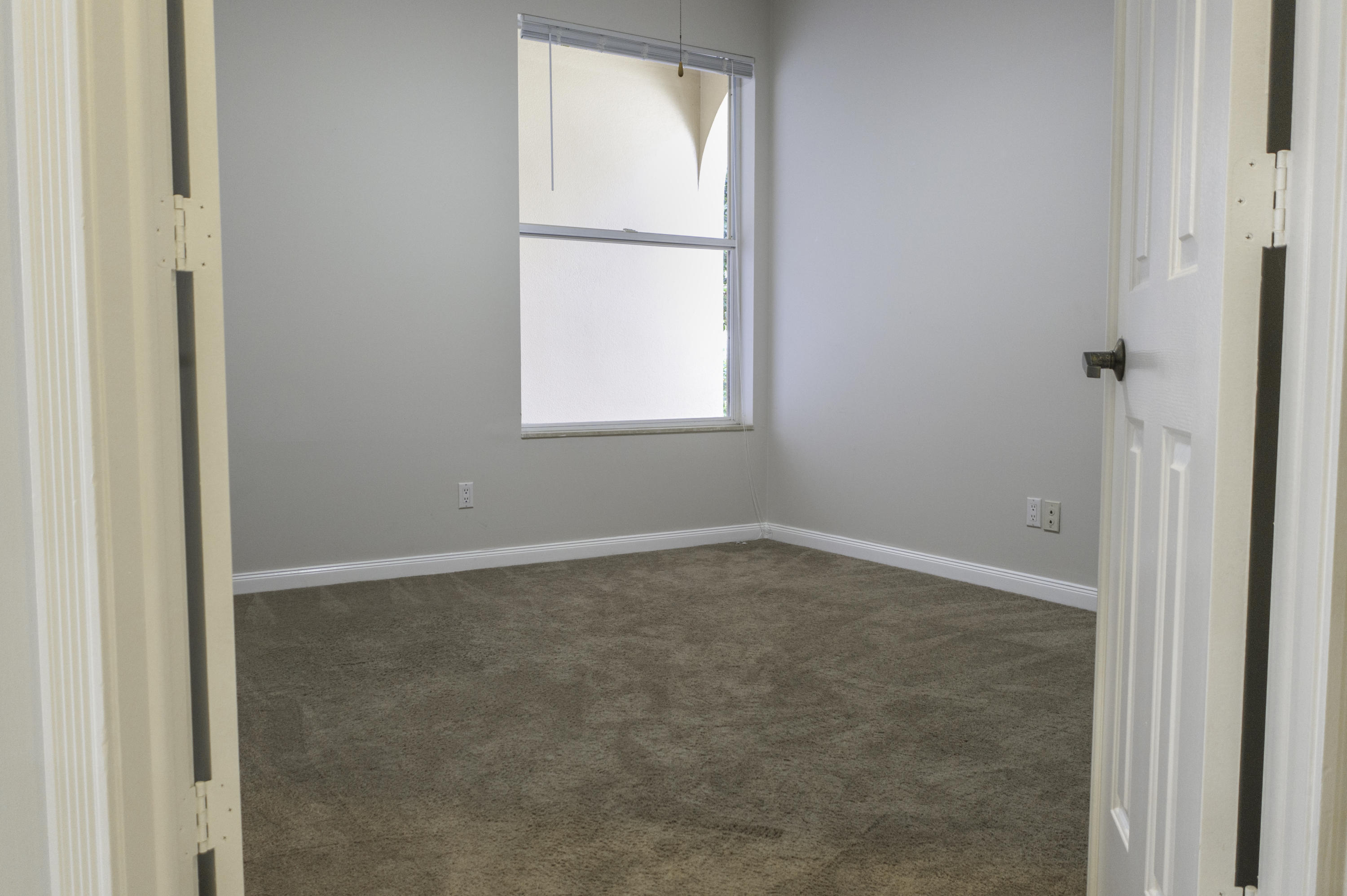 168 South Hampton Drive Jupiter, FL 33458 - Photo 11 of 21 an empty room with a window