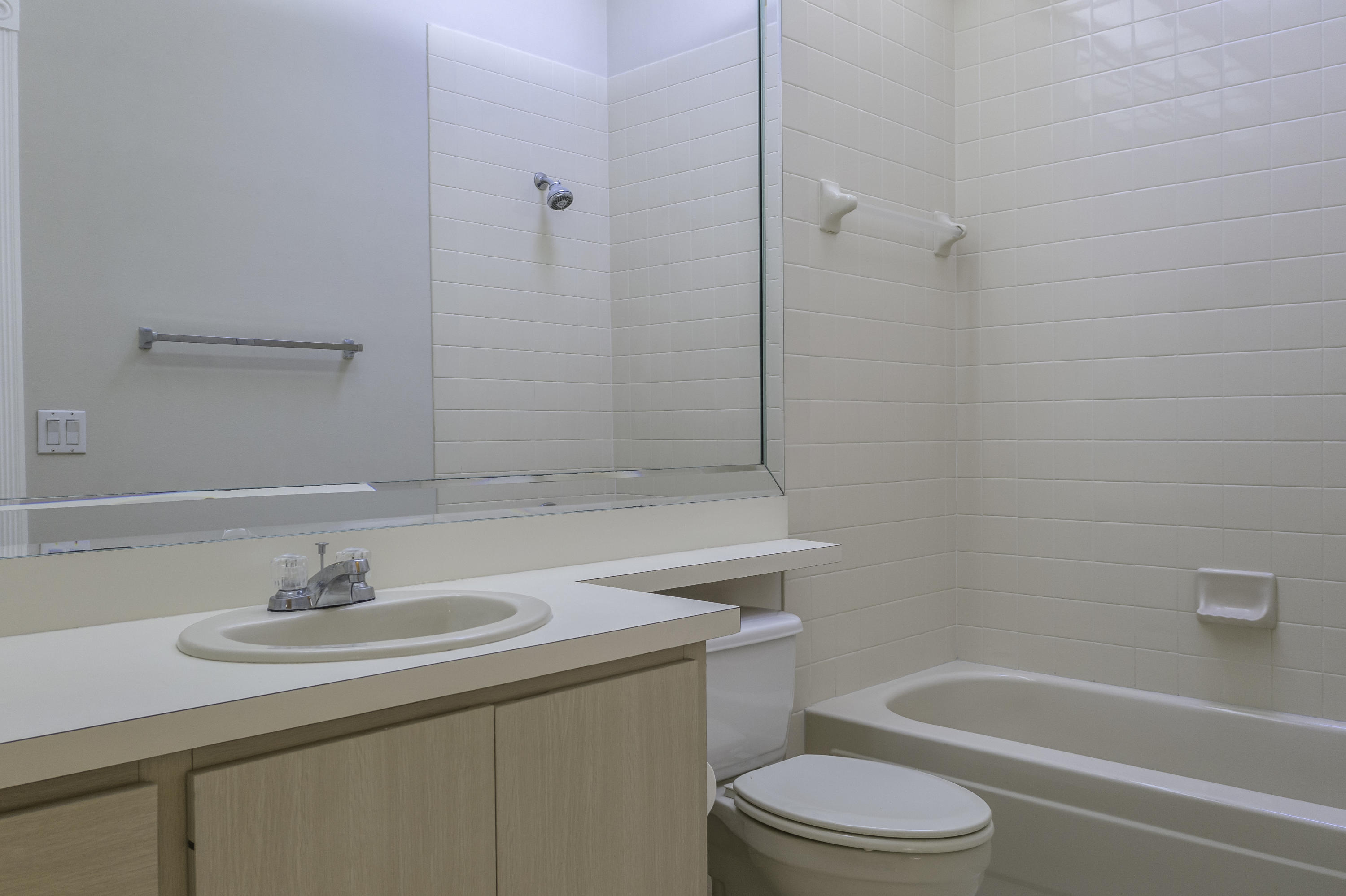 168 South Hampton Drive Jupiter, FL 33458 - Photo 12 of 21 a bathroom with a sink toilet vanity and shower