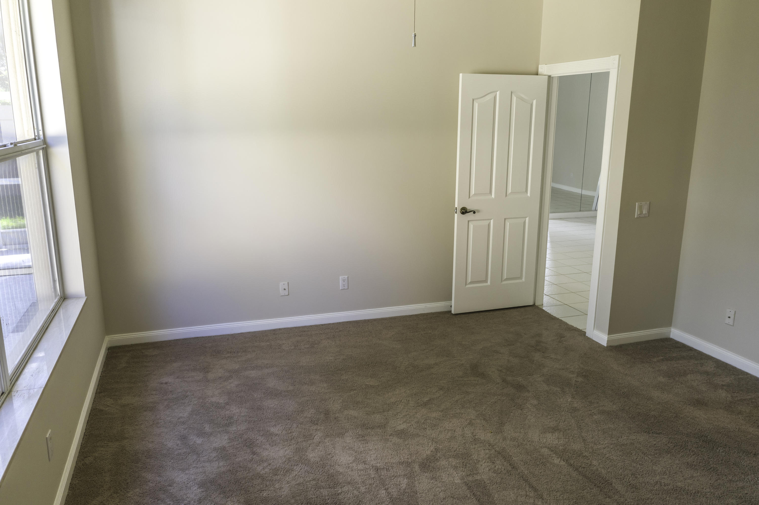 168 South Hampton Drive Jupiter, FL 33458 - Photo 7 of 21 an empty room with windows