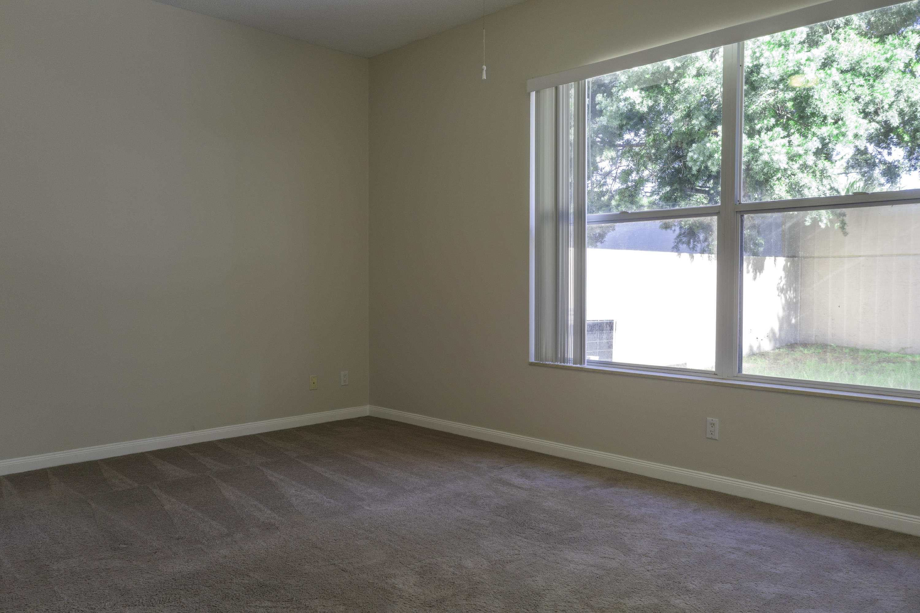 168 South Hampton Drive Jupiter, FL 33458 - Photo 8 of 21 an empty room with a window