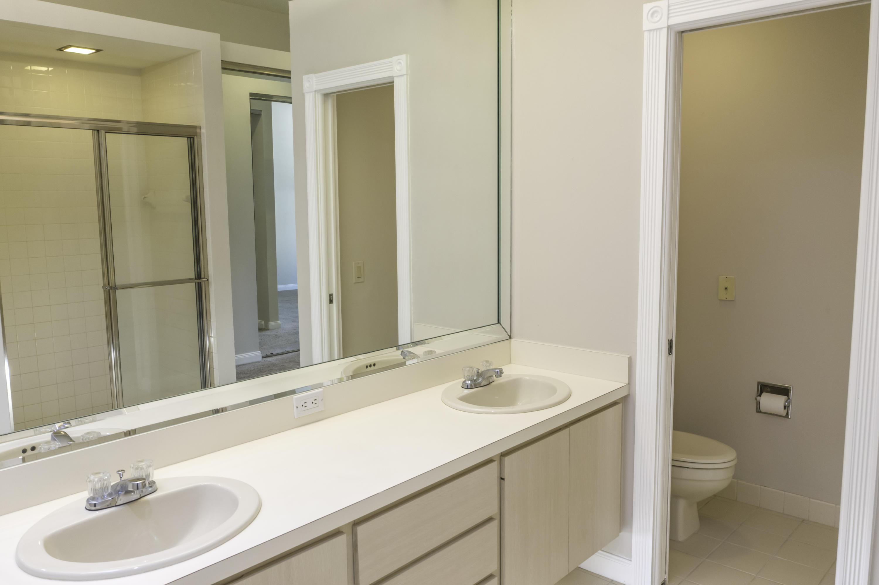 168 South Hampton Drive Jupiter, FL 33458 - Photo 10 of 21 a bathroom with a sink and a mirror