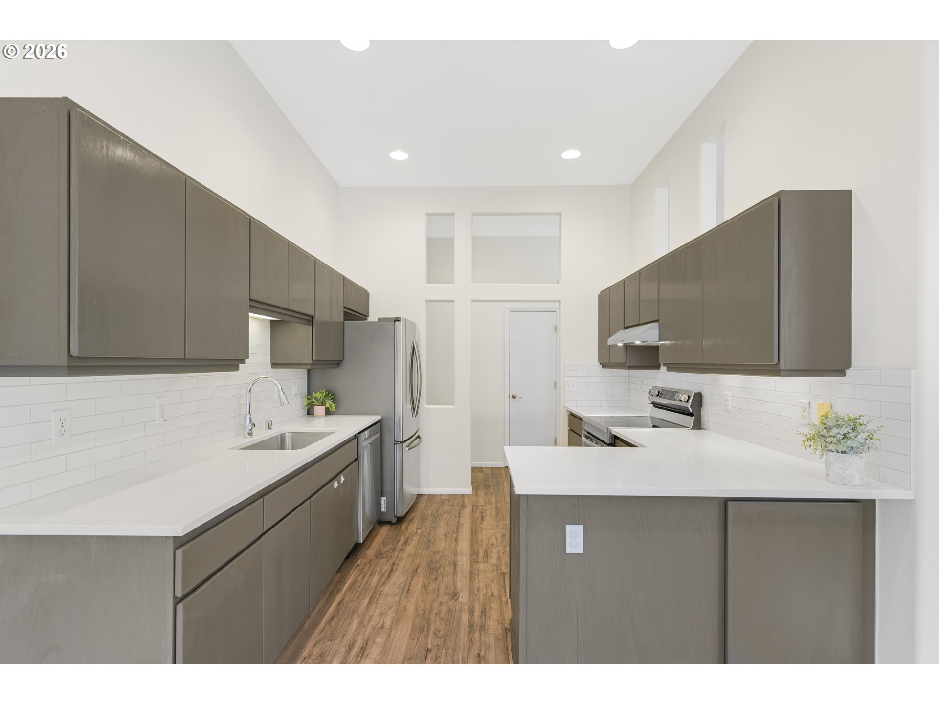 2415 Northwest Norwood Place Camas, WA 98607 - Photo 11 of 36 a kitchen with a sink a counter top space and appliances